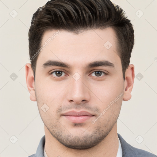 Neutral white young-adult male with short  brown hair and brown eyes