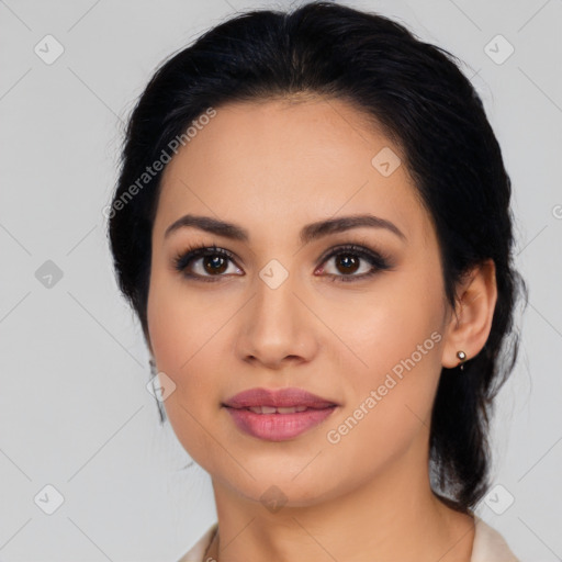 Joyful latino young-adult female with medium  black hair and brown eyes