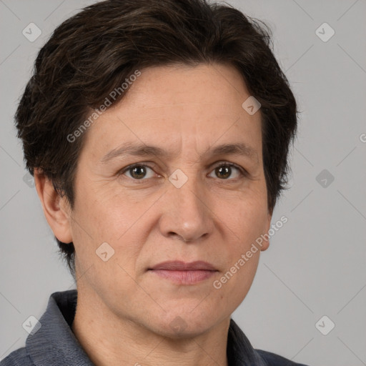 Joyful white adult female with medium  brown hair and brown eyes