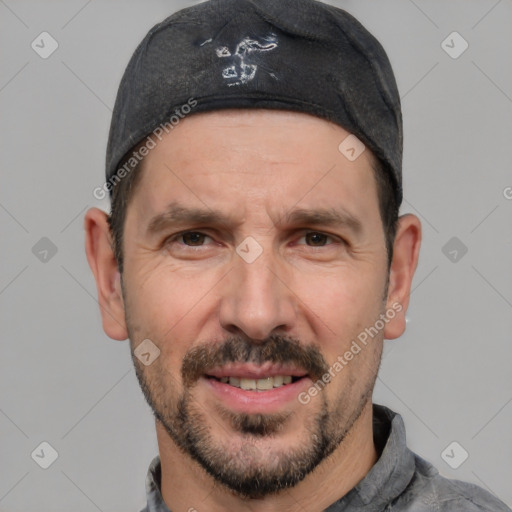 Joyful white adult male with short  black hair and brown eyes