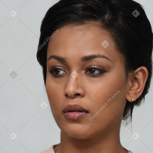 Neutral black young-adult female with medium  black hair and brown eyes