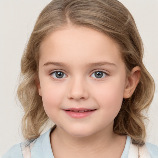 Joyful white child female with medium  brown hair and grey eyes