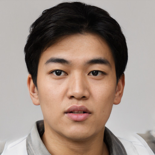 Neutral asian young-adult male with short  black hair and brown eyes