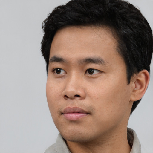 Neutral asian young-adult male with short  black hair and brown eyes