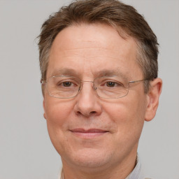 Joyful white middle-aged male with short  brown hair and brown eyes