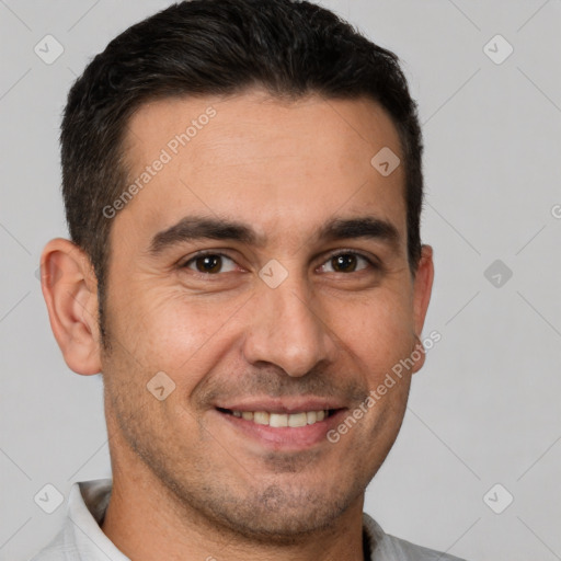 Joyful white adult male with short  brown hair and brown eyes