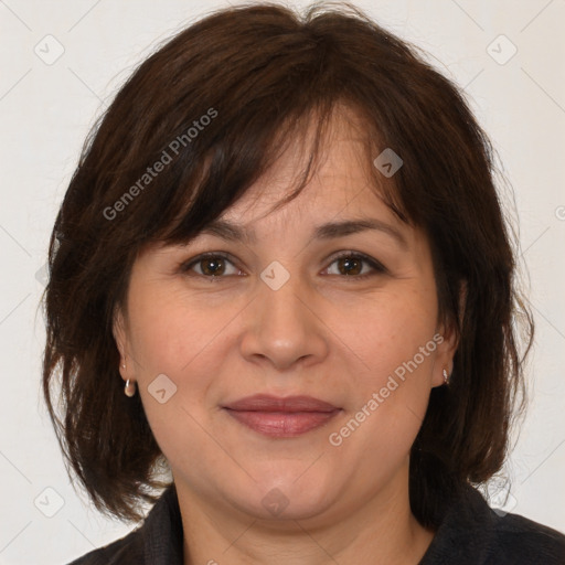 Joyful white adult female with medium  brown hair and brown eyes