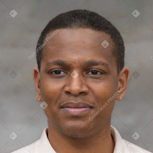 Joyful latino young-adult male with short  brown hair and brown eyes
