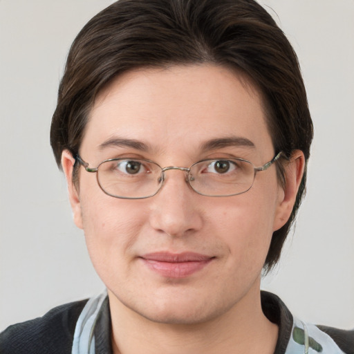 Joyful white adult female with medium  brown hair and grey eyes