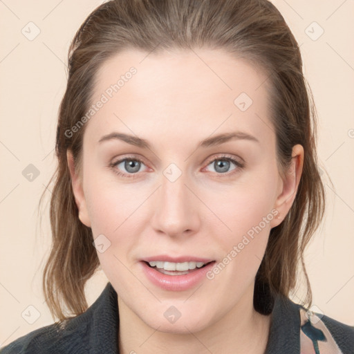 Joyful white young-adult female with medium  brown hair and grey eyes