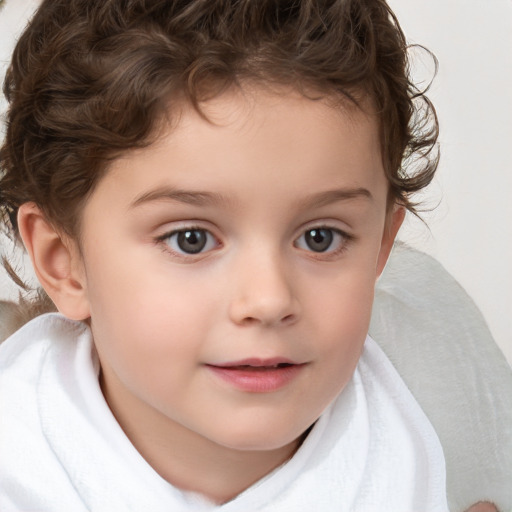 Joyful white child male with short  brown hair and brown eyes