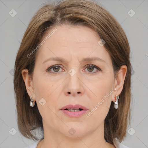 Joyful white adult female with medium  brown hair and brown eyes