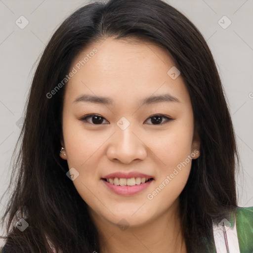 Joyful asian young-adult female with long  brown hair and brown eyes