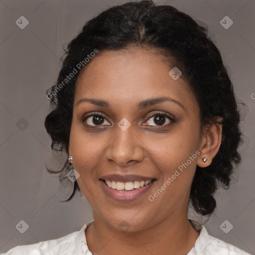 Joyful black young-adult female with medium  brown hair and brown eyes