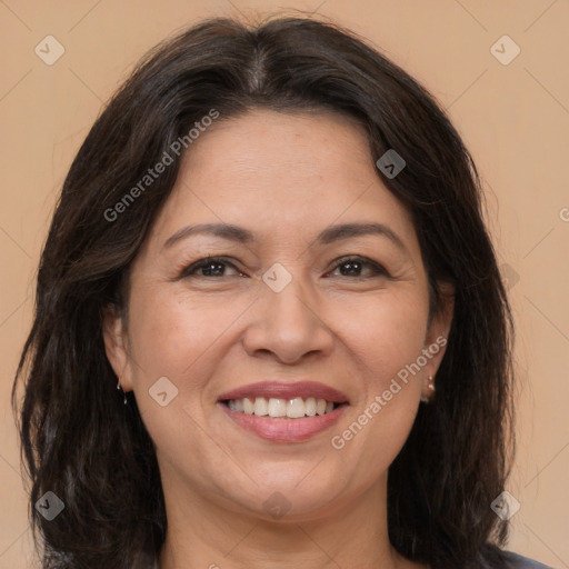 Joyful white adult female with medium  brown hair and brown eyes