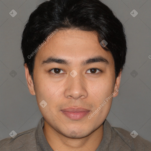 Joyful latino young-adult male with short  brown hair and brown eyes