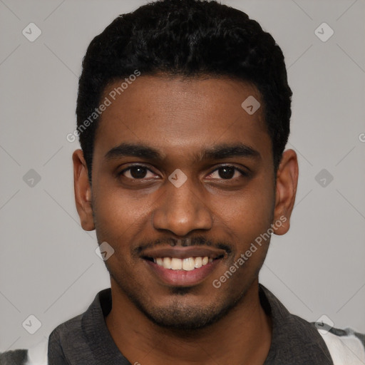 Joyful black young-adult male with short  black hair and brown eyes