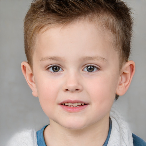 Joyful white child male with short  brown hair and brown eyes