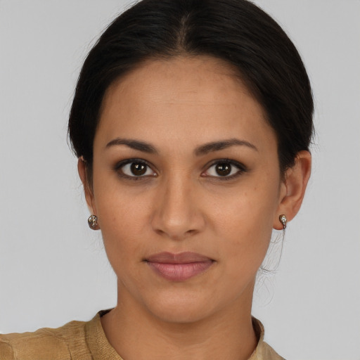 Joyful latino young-adult female with short  brown hair and brown eyes