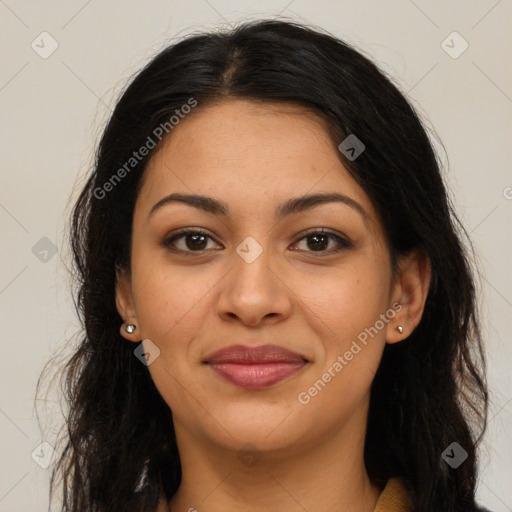 Joyful latino young-adult female with long  brown hair and brown eyes