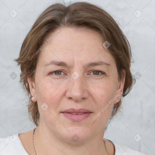 Joyful white adult female with medium  brown hair and grey eyes