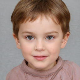 Joyful white child male with short  brown hair and brown eyes