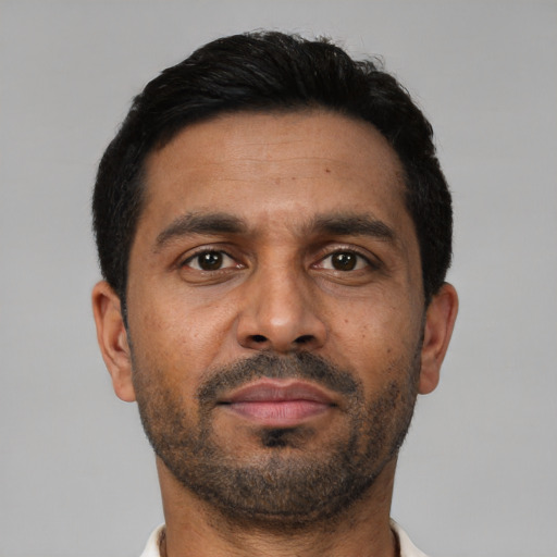 Neutral latino adult male with short  black hair and brown eyes