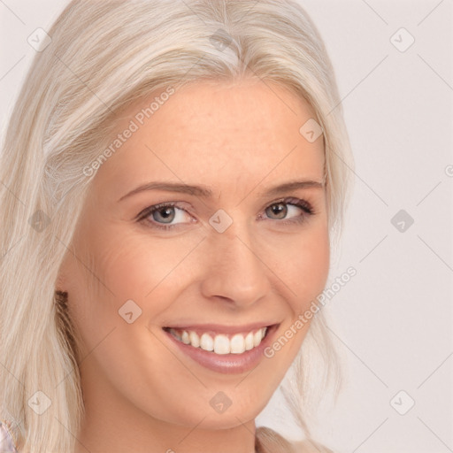 Joyful white young-adult female with long  blond hair and blue eyes