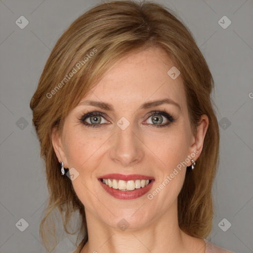 Joyful white adult female with medium  brown hair and blue eyes