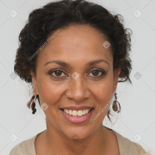 Joyful black adult female with short  brown hair and brown eyes