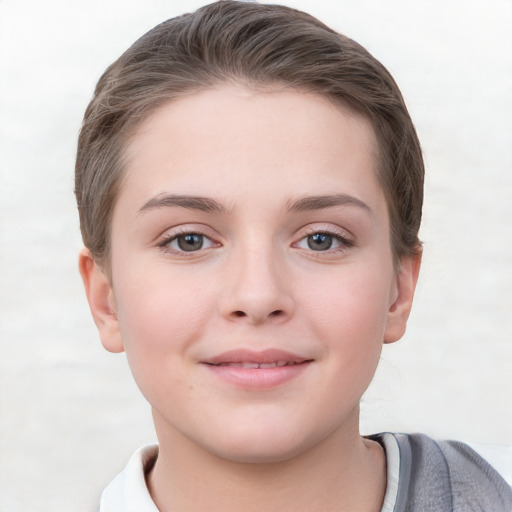 Joyful white child female with short  brown hair and grey eyes