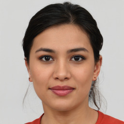 Joyful asian young-adult female with medium  brown hair and brown eyes