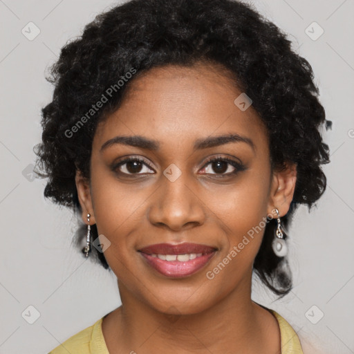 Joyful black young-adult female with long  black hair and brown eyes