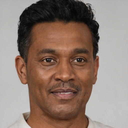 Neutral latino adult male with short  black hair and brown eyes