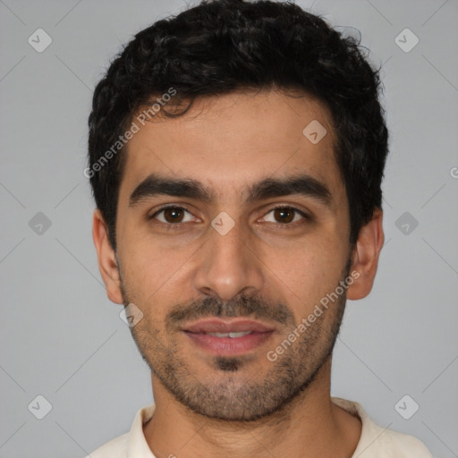 Joyful white young-adult male with short  black hair and brown eyes