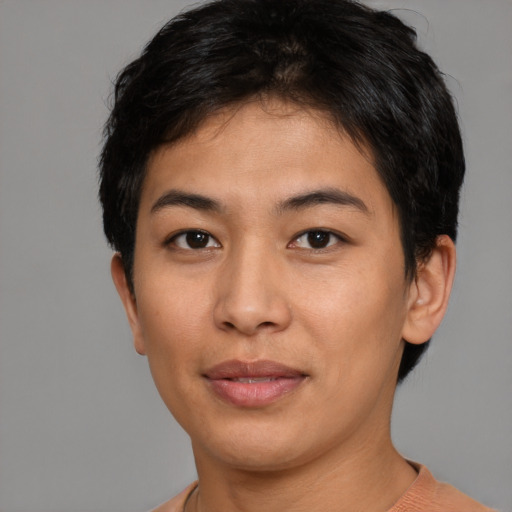 Joyful asian young-adult female with short  brown hair and brown eyes
