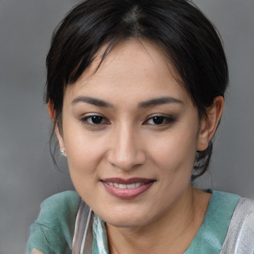 Joyful asian young-adult female with medium  brown hair and brown eyes
