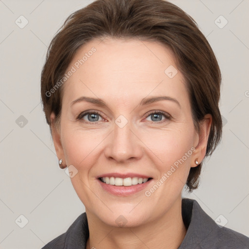 Joyful white adult female with medium  brown hair and grey eyes