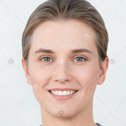 Joyful white young-adult female with short  brown hair and grey eyes