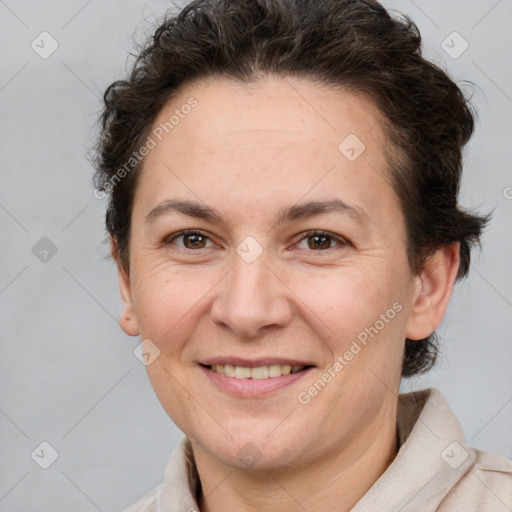 Joyful white adult female with short  brown hair and brown eyes