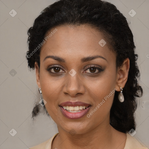 Joyful black young-adult female with long  brown hair and brown eyes