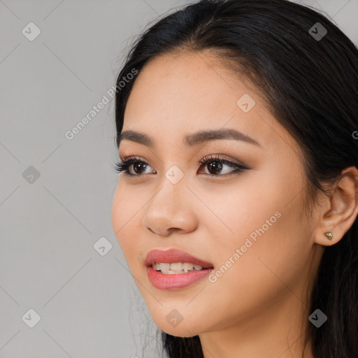 Joyful white young-adult female with long  black hair and brown eyes