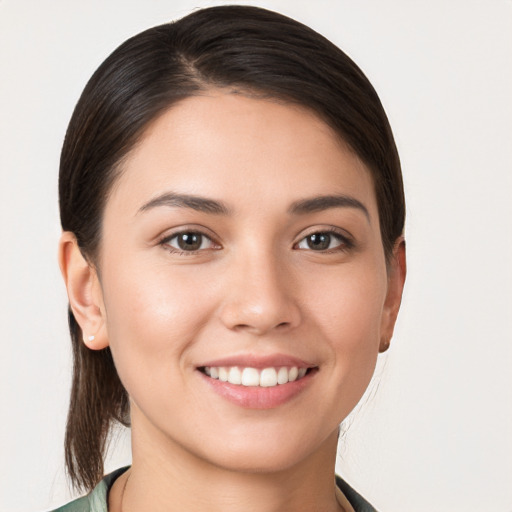 Joyful white young-adult female with medium  brown hair and brown eyes