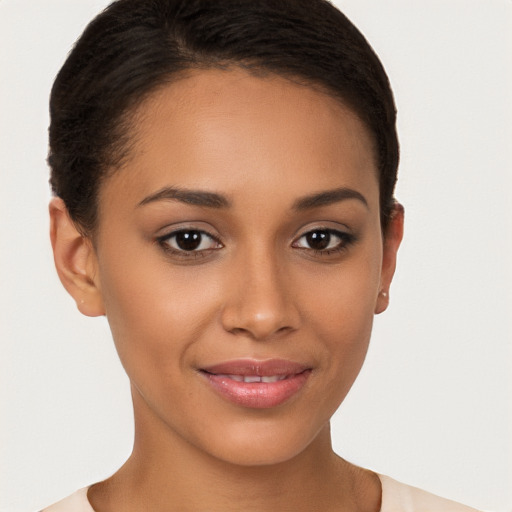 Joyful latino young-adult female with short  brown hair and brown eyes