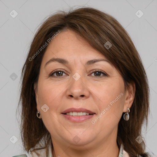 Joyful white adult female with medium  brown hair and grey eyes