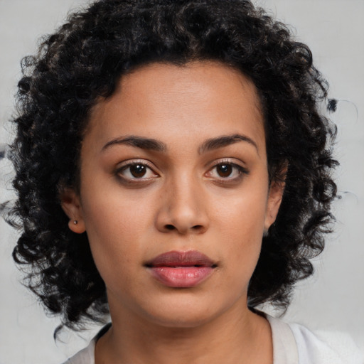 Neutral latino young-adult female with medium  brown hair and brown eyes