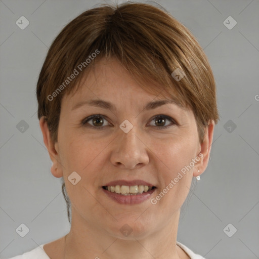 Joyful white adult female with short  brown hair and brown eyes