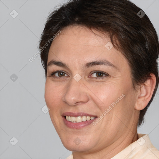 Joyful white adult female with short  brown hair and brown eyes