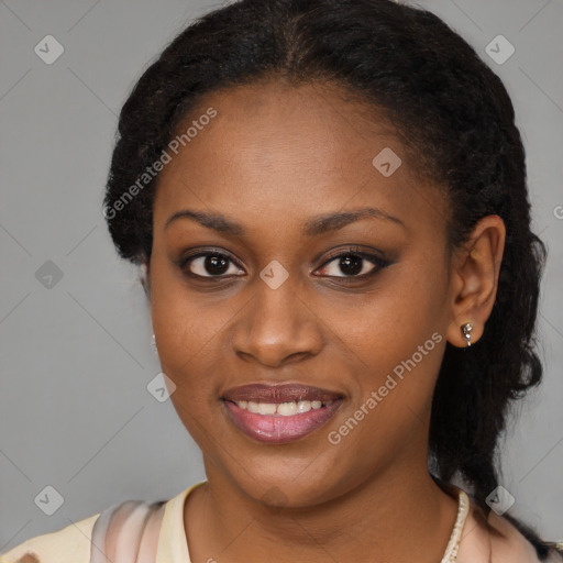 Joyful black young-adult female with long  brown hair and brown eyes