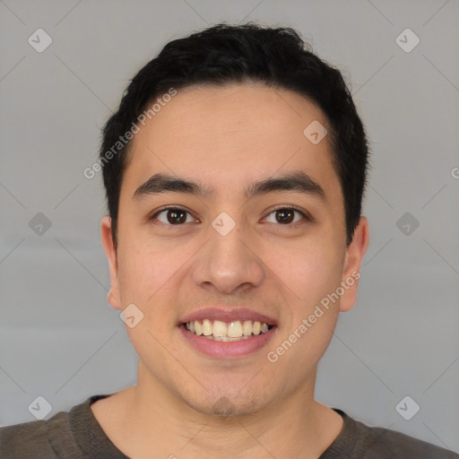 Joyful latino young-adult male with short  black hair and brown eyes